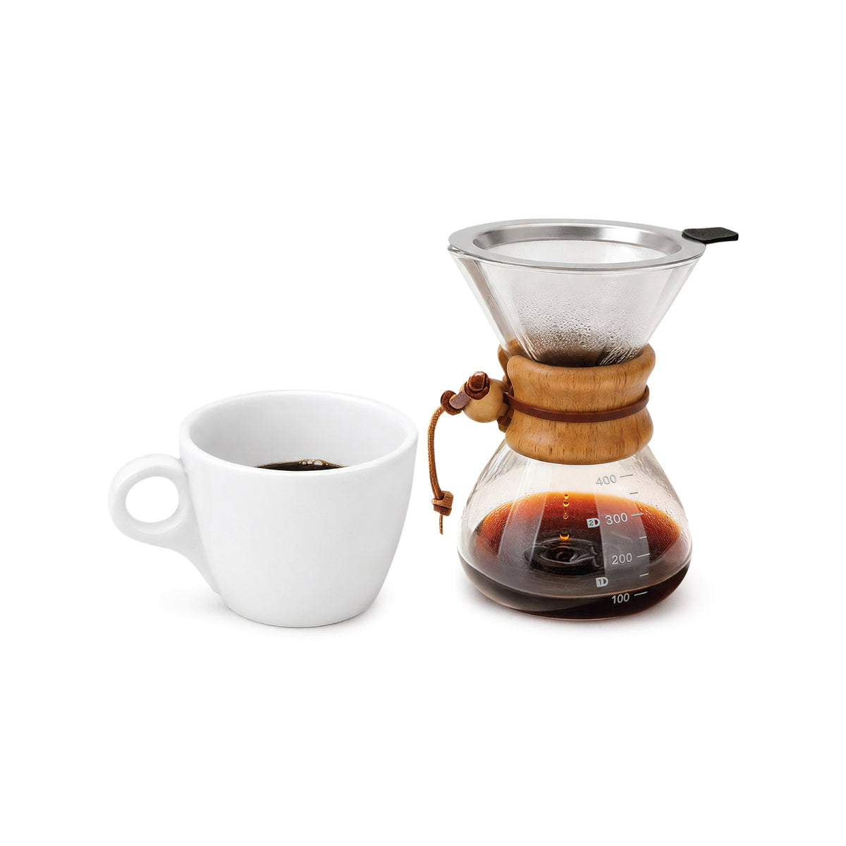EspressoWorks 13.5 oz glass dripper and carafe set with reusable metal filter, next to a cup of coffee