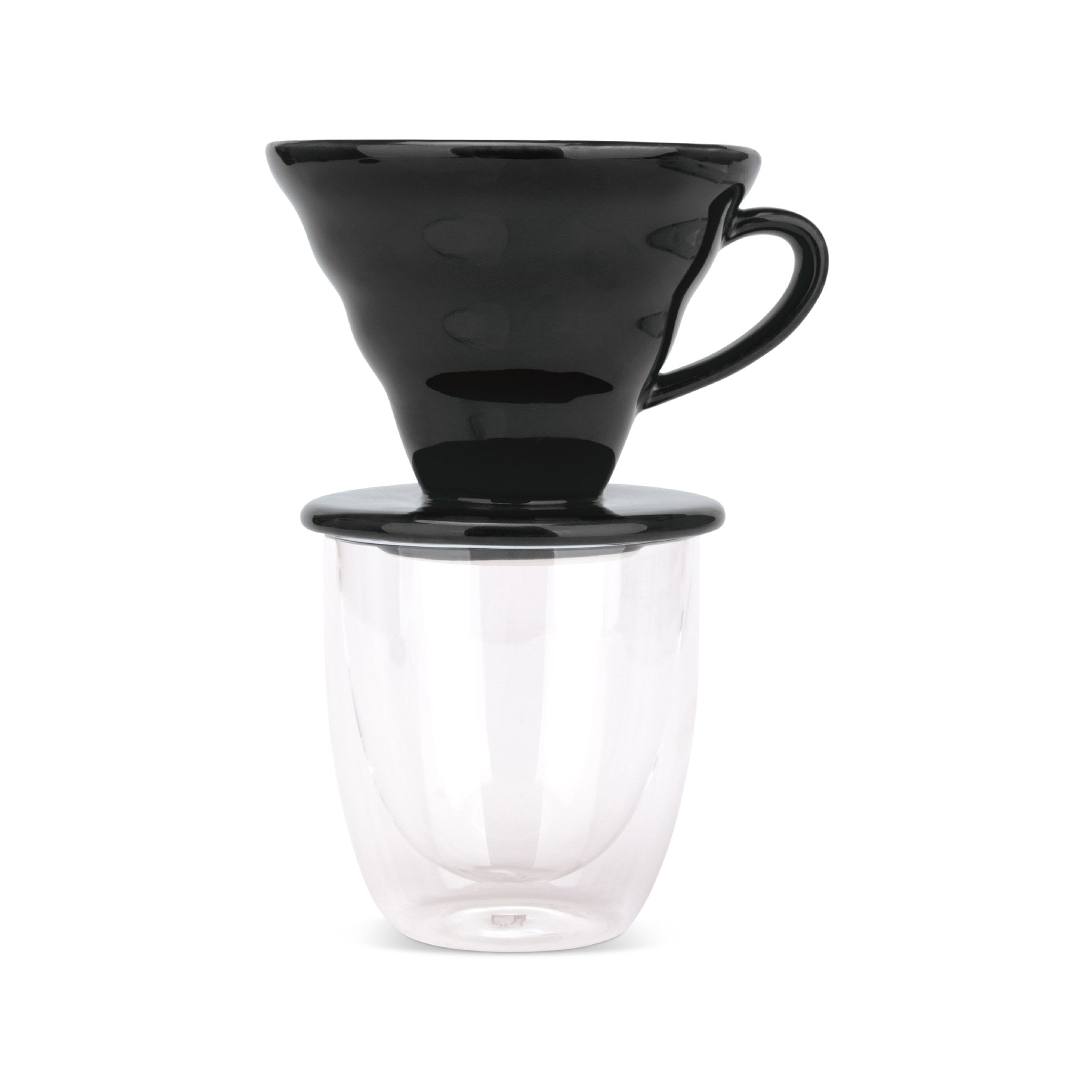 EspressoWorks black ceramic pour over coffee dripper sitting on a double-wall glass cup
