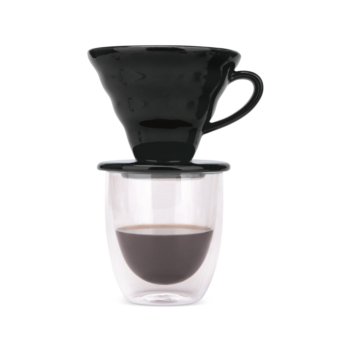 Black pour over dripper on a double-wall glass of freshly brewed coffee