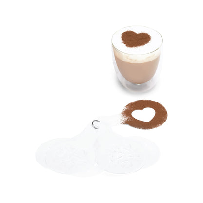Heart stencil dusted with cocoa beside a latte topped with a cocoa heart