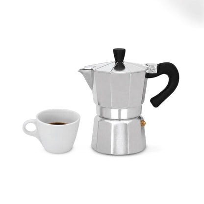 3-cup moka pot next to a cup of fresh espresso