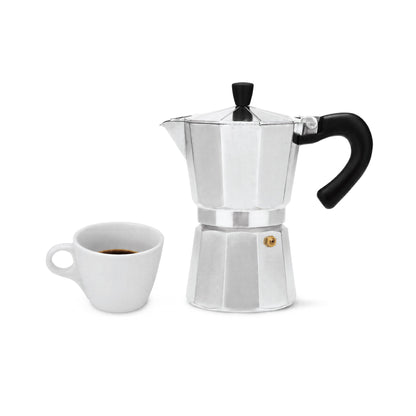 6-cup moka pot next to a cup of fresh espresso