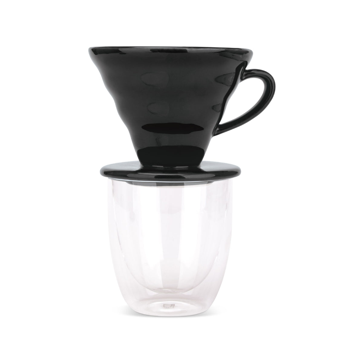 EspressoWorks black ceramic pour over coffee dripper sitting on a double-wall glass cup