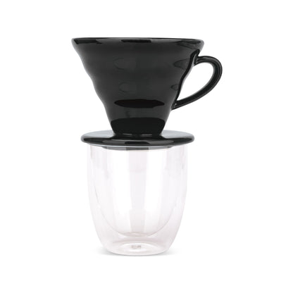 EspressoWorks black ceramic pour over coffee dripper sitting on a double-wall glass cup