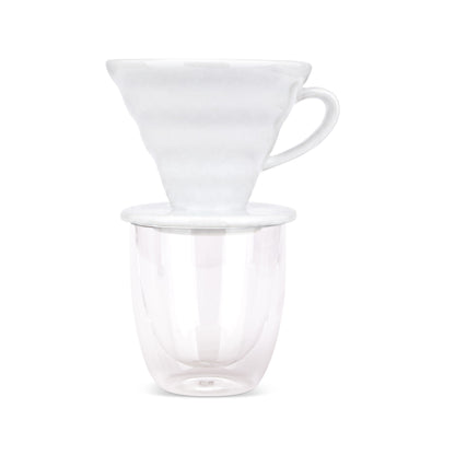 EspressoWorks white ceramic pour over coffee dripper sitting on a double-wall glass cup