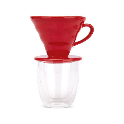 EspressoWorks red ceramic pour over coffee dripper sitting on a double-wall glass cup