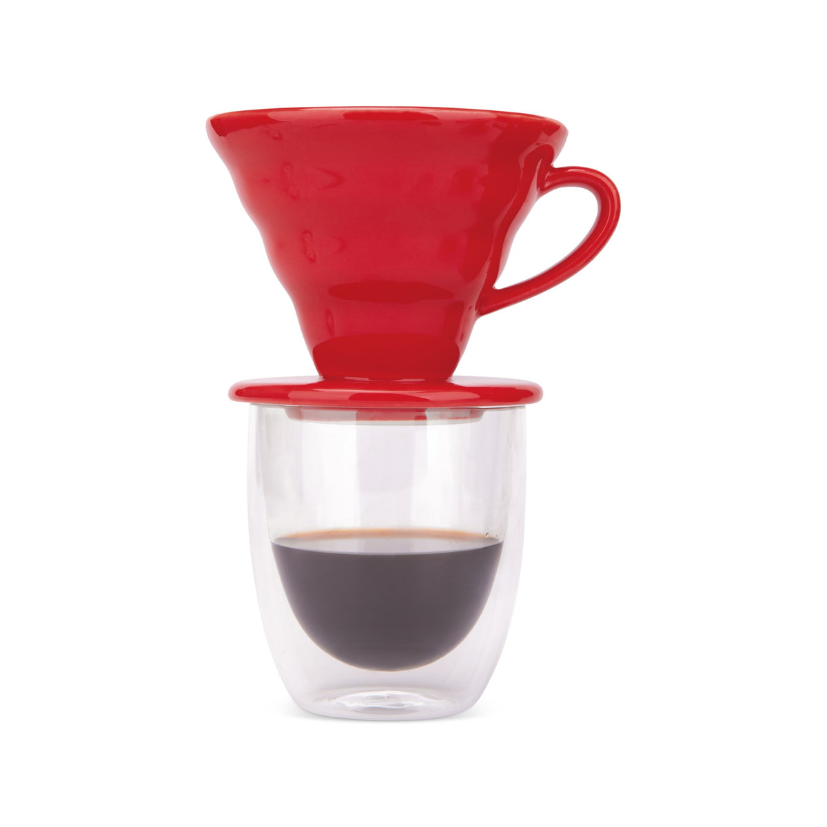 Red pour over dripper on a double-wall glass of freshly brewed coffee