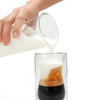 Pouring fresh frothy foam from the EspressoWorks Battery Operated Milk Frother