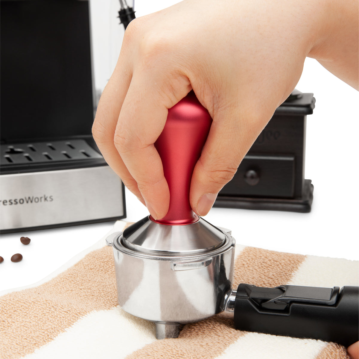 EspressoWorks Espresso Tamper Red expertly tamps in coffee grinds to make a puck for a balanced brew
